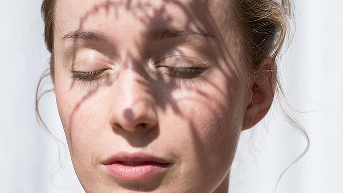 Woman with eyes closed
