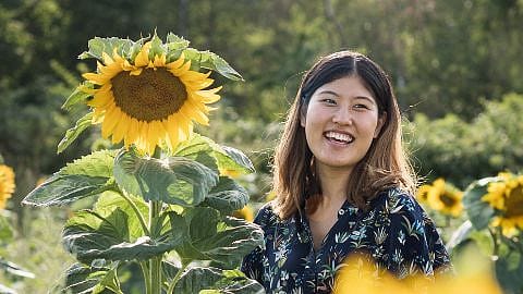 woman with sun flowers